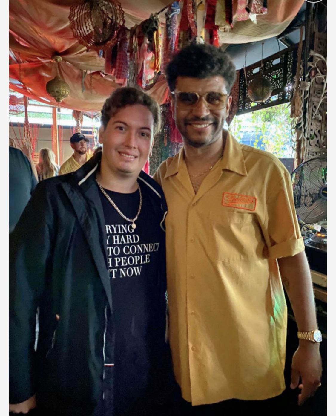 Cristhian Balcazar with a fan at a festival after-party